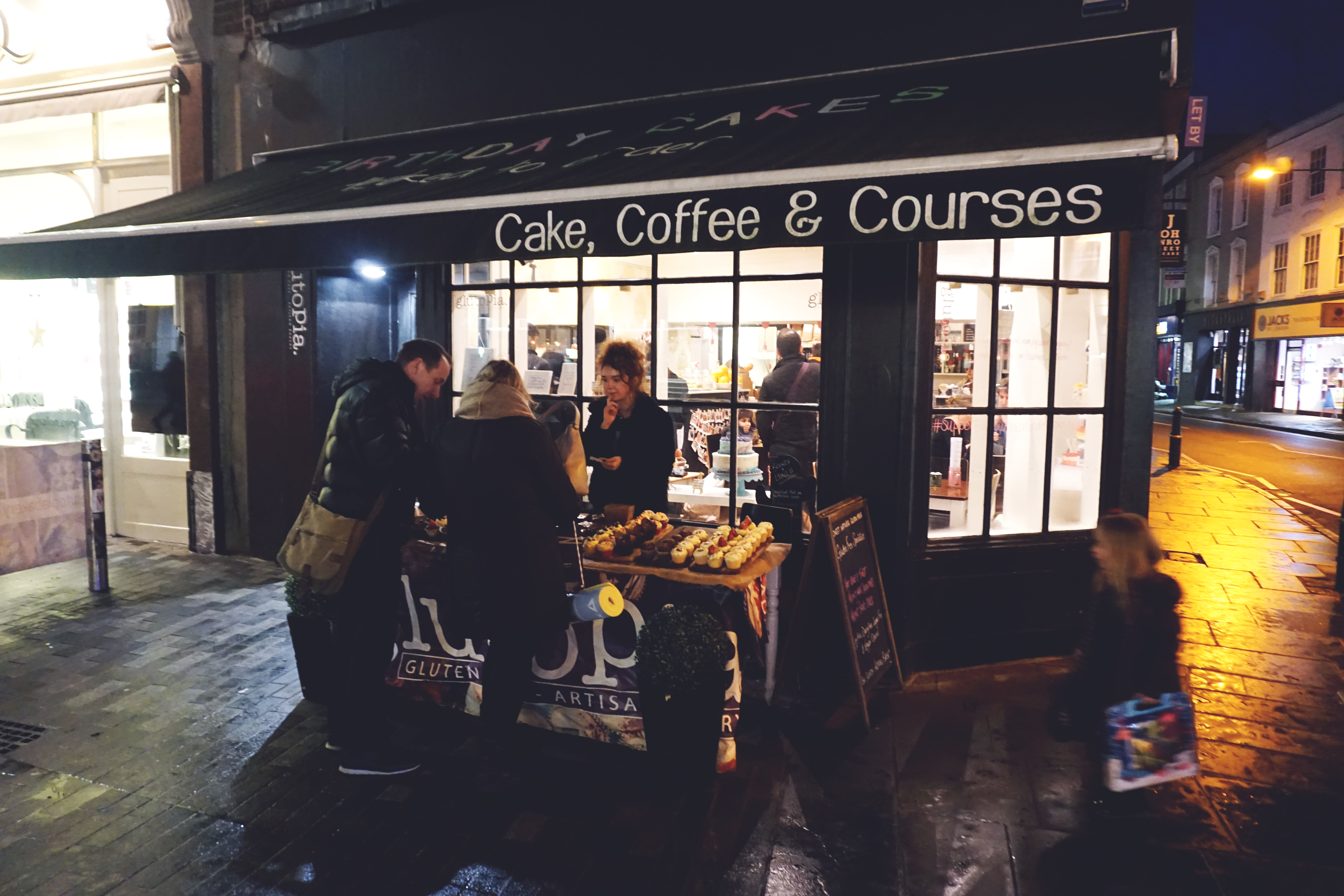 Glutopia London gluten free bakery and cafe shop front (with kiosk offering cake and cupcake samples)